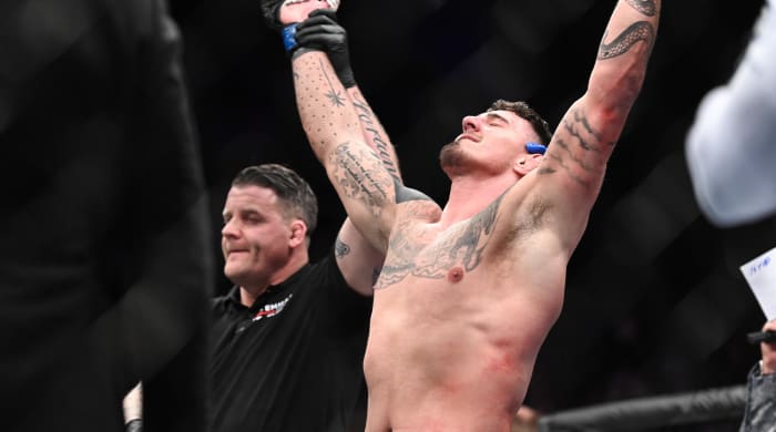 Mar 19, 2022; London, UK; Tom Aspinall (blue gloves) defeats Alexander Volkov (red gloves) during UFC Fight Night at O2 Arena.